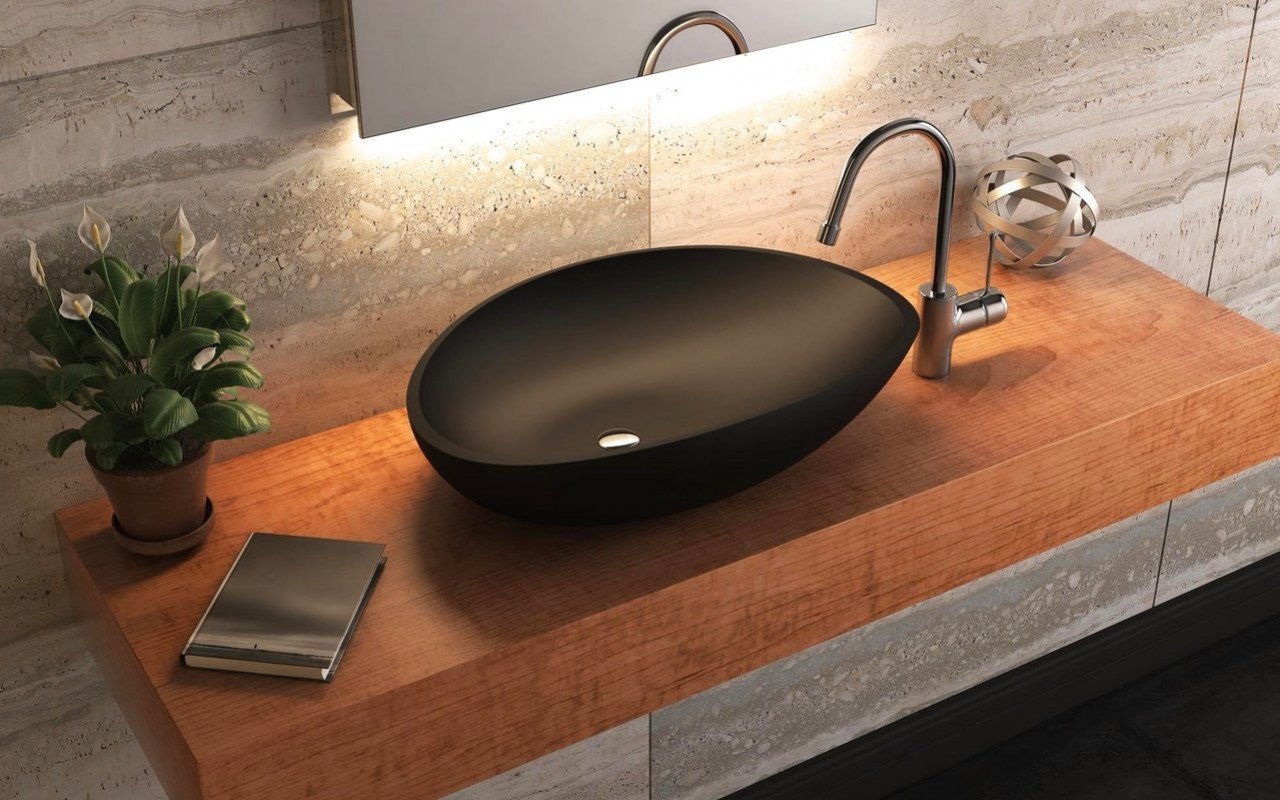 Unique U-shape fits around plumbing. With two trays, this sink